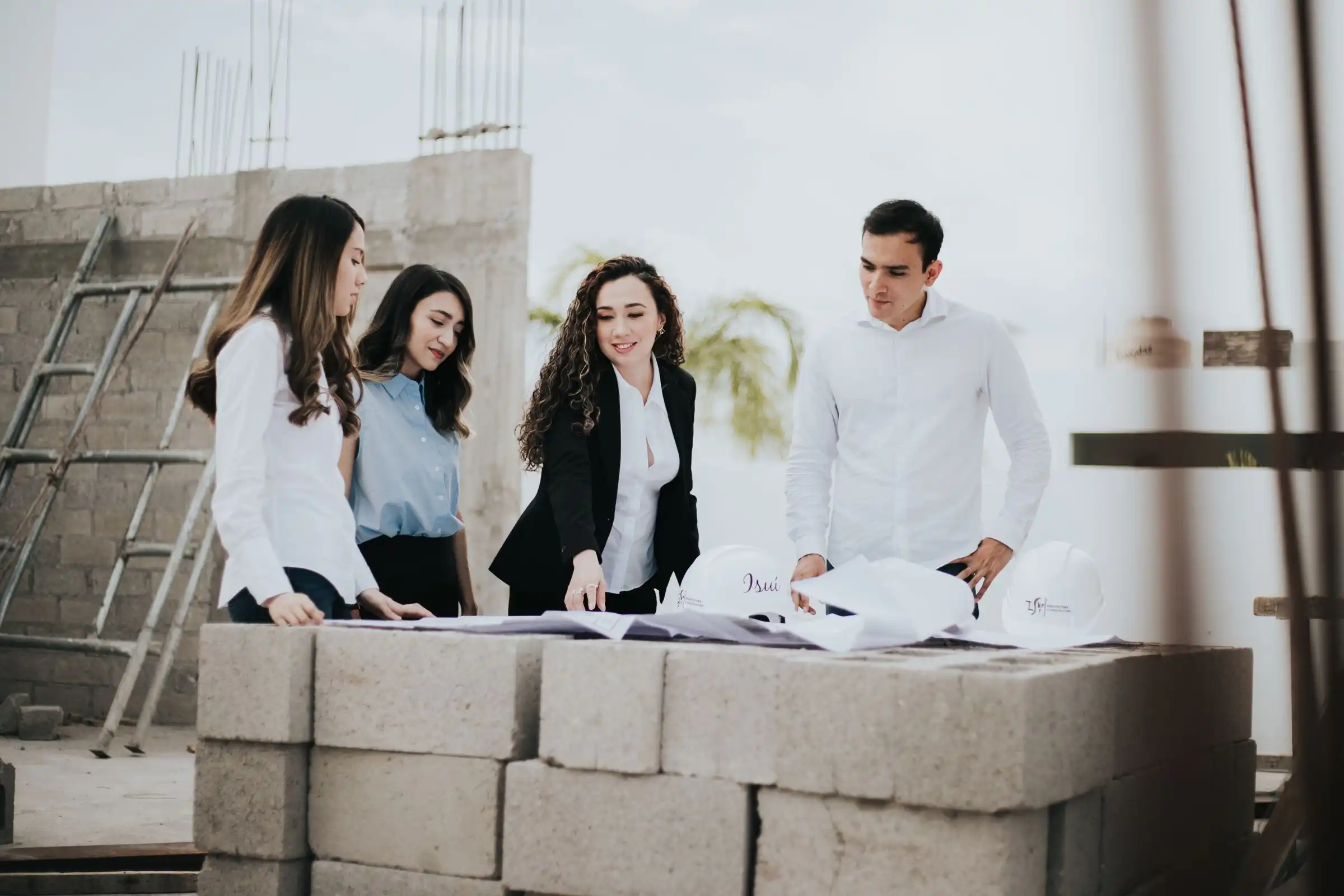 Project team reviewing drawings on a construction site